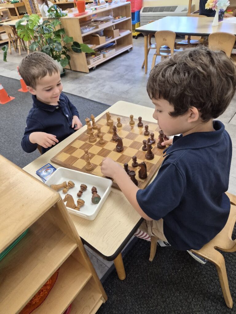 Primary students playing chess