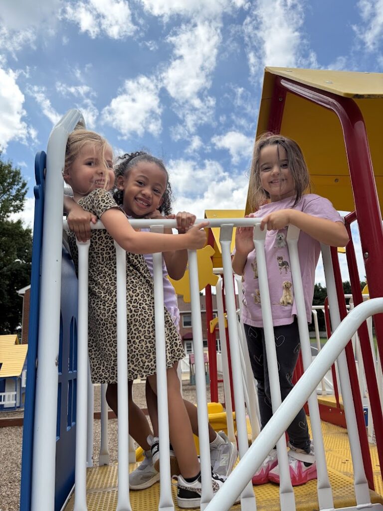 Primary students smiling together
