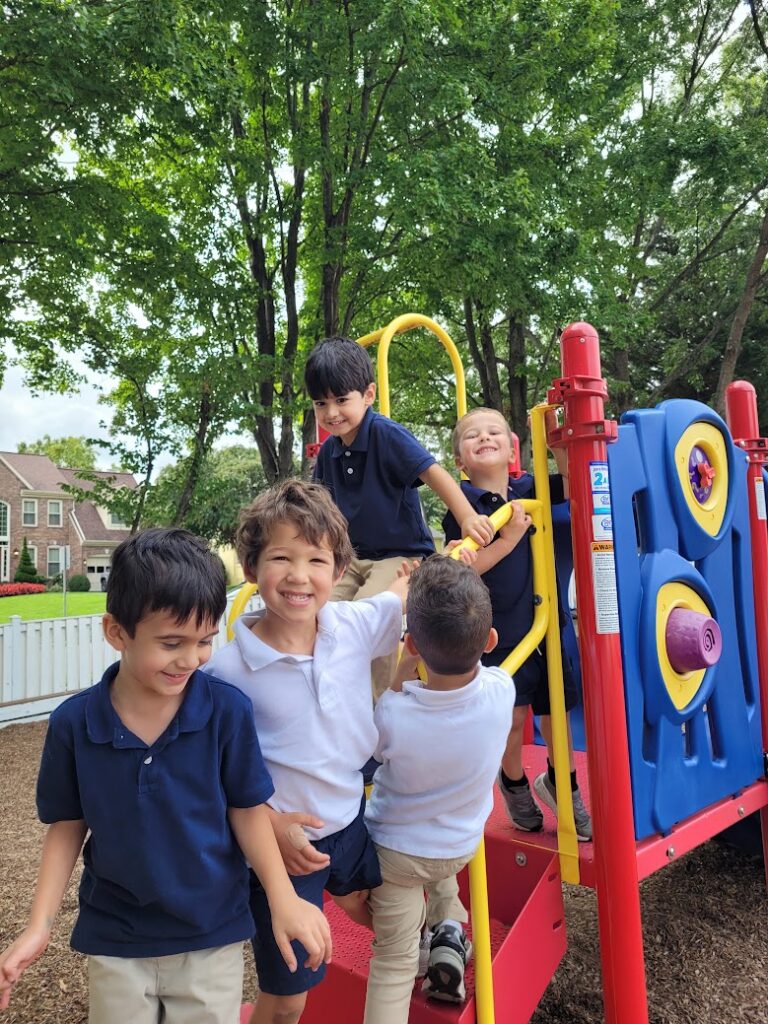 Smiling Primary students on the playground