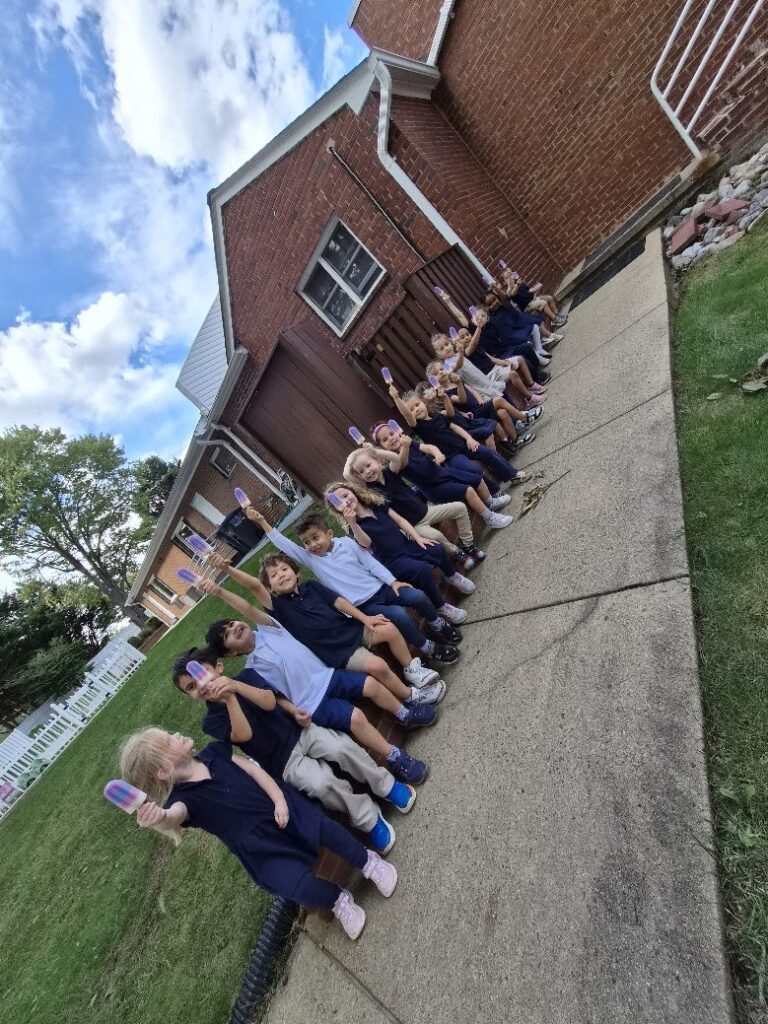 Primary student enjoying a popsicle